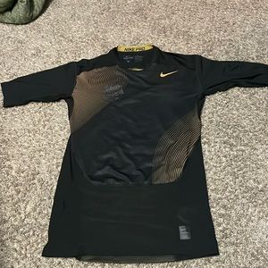 Nike Pro compression dri-fit shirt. Gold and black
